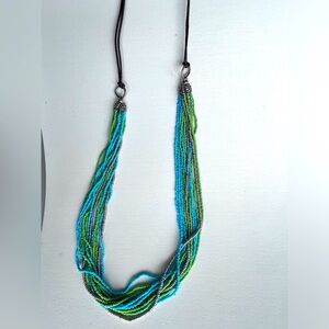 Turquoise green silver Multi layered beaded necklace. 32 inches long
